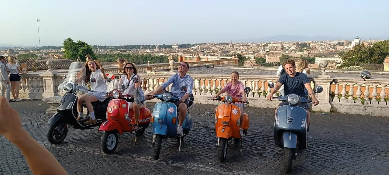Group on Vespas with a panoramic view over Rome from the Janiculum