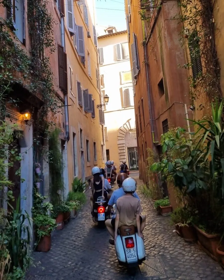 Vespa in an ivy-covered alley in Trastevere
