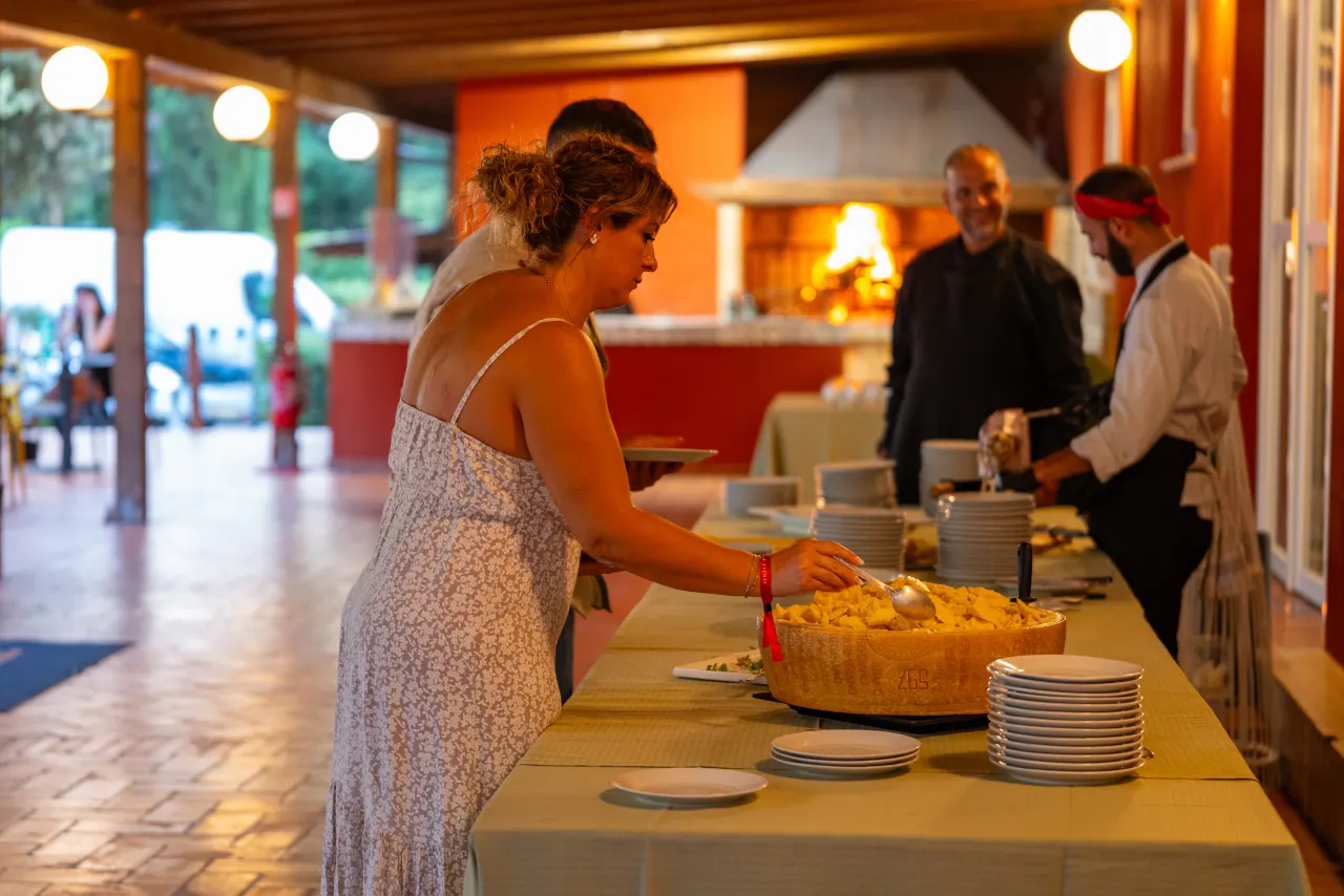 A guest at the buffet with the grill in the background