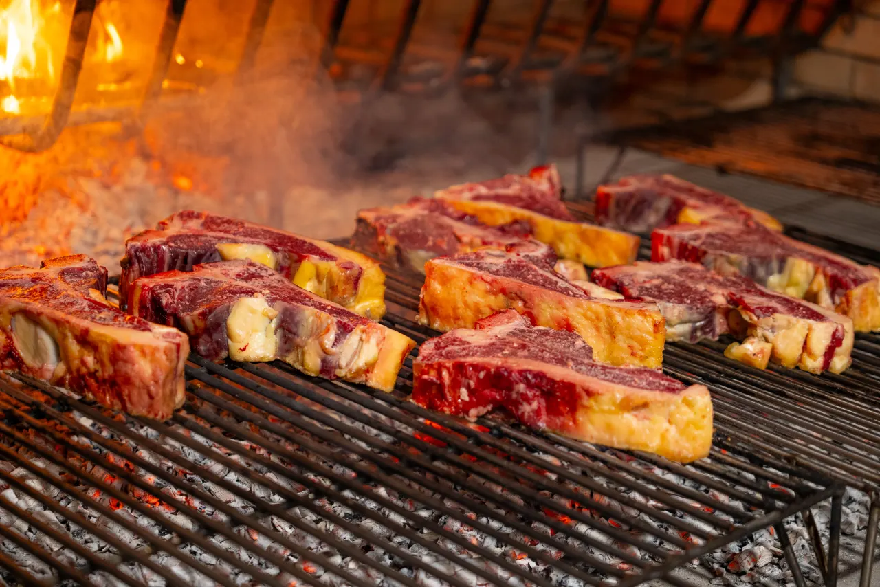 Prime cuts of meat on the live-fire grill