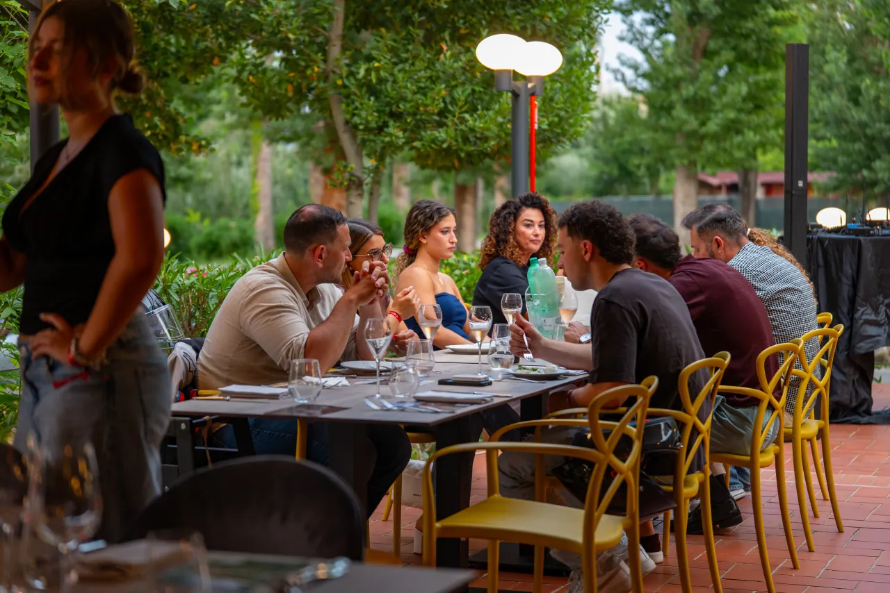Conviviality in the Tiber Village park during the evening