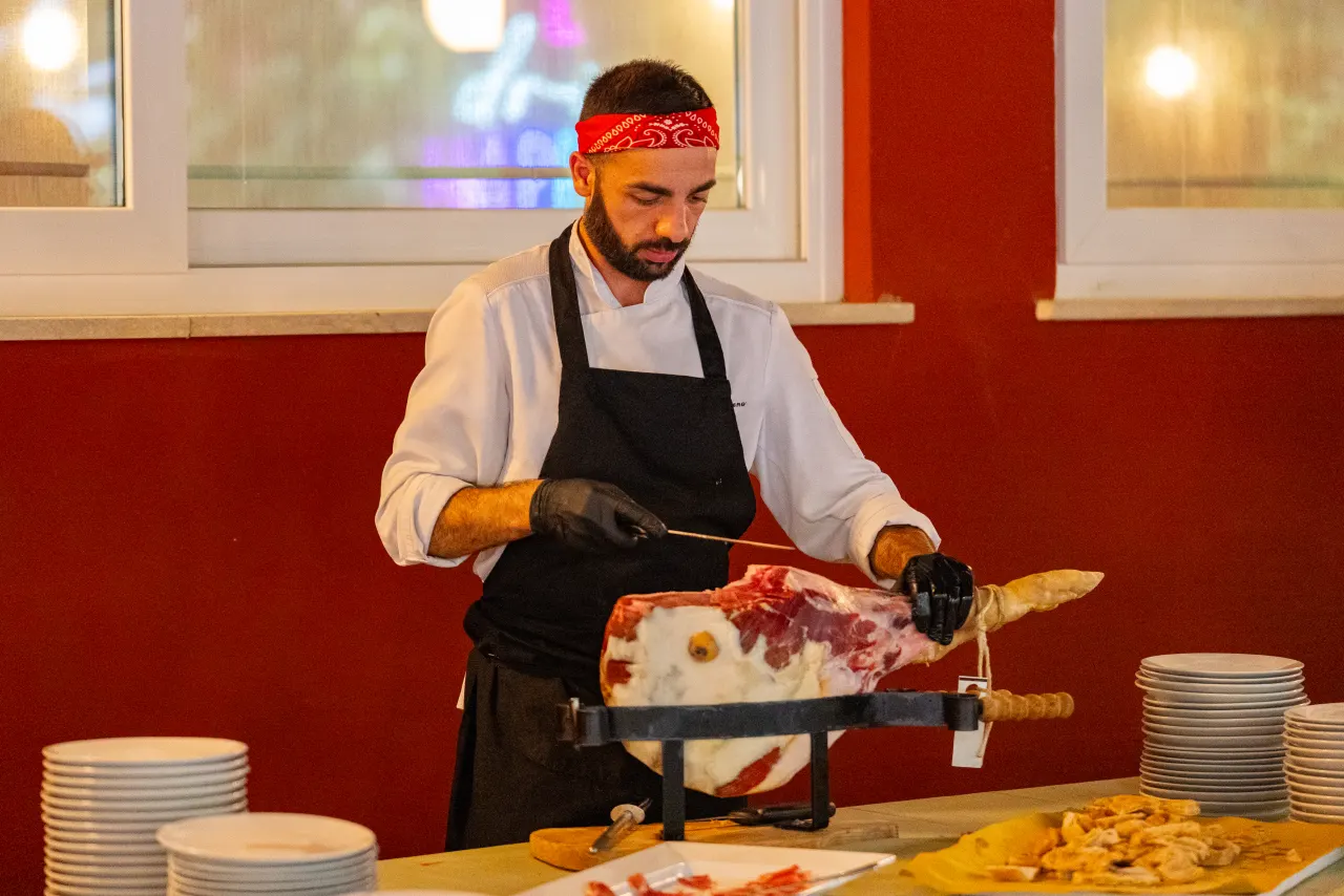 Ham sliced at the evening buffet