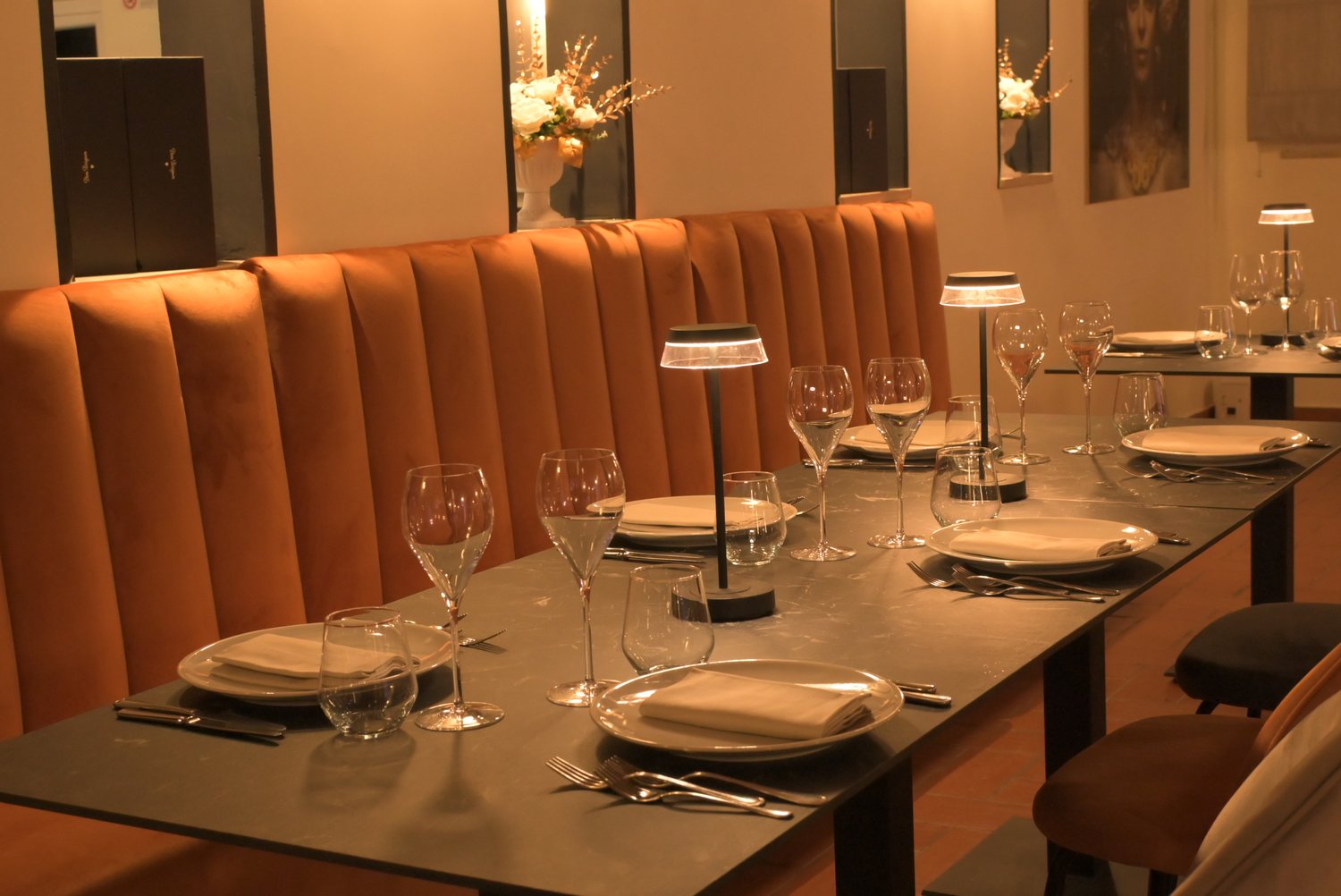 Indoor setting of the restaurant surrounded by greenery